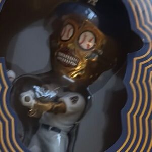 Gold and White Baseball Skull Figurine